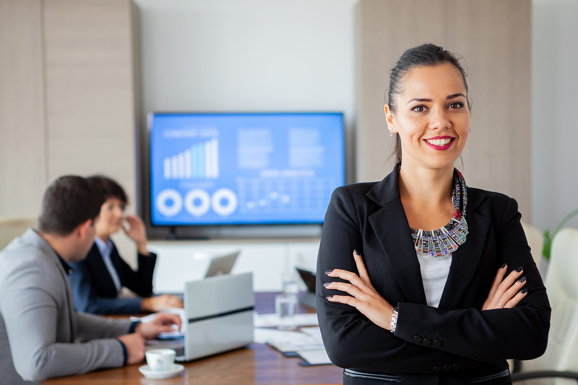 Happy beautiful bussines woman in conference room. Successful woman.